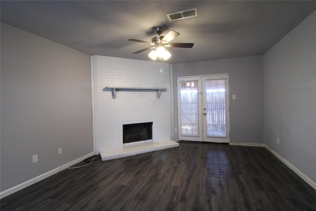 unfurnished living room with wood finished floors, french doors, visible vents, and baseboards