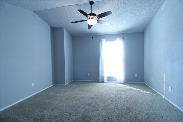 spare room featuring baseboards, carpet flooring, a textured ceiling, and ceiling fan