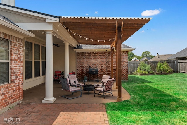 view of patio featuring a ceiling fan, fence, a pergola, and a fire pit