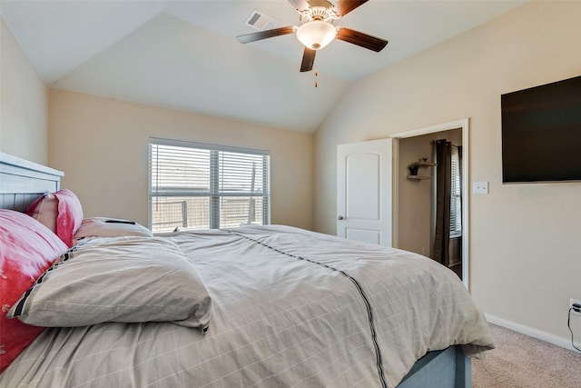 carpeted bedroom featuring visible vents, a ceiling fan, baseboards, and vaulted ceiling