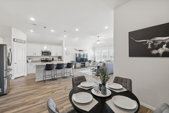 dining room featuring recessed lighting, light wood-style floors, and visible vents