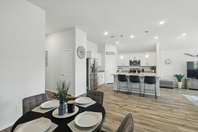 dining area with visible vents, recessed lighting, and light wood-style floors