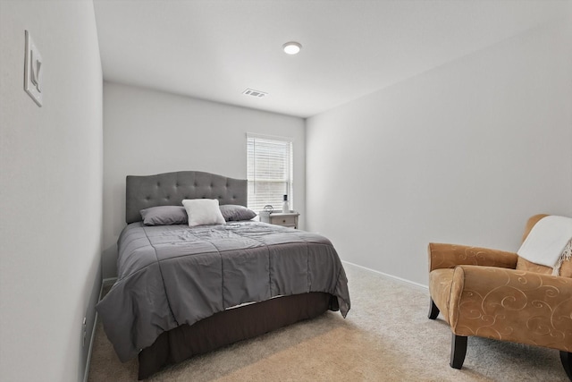 bedroom featuring baseboards, visible vents, and carpet floors