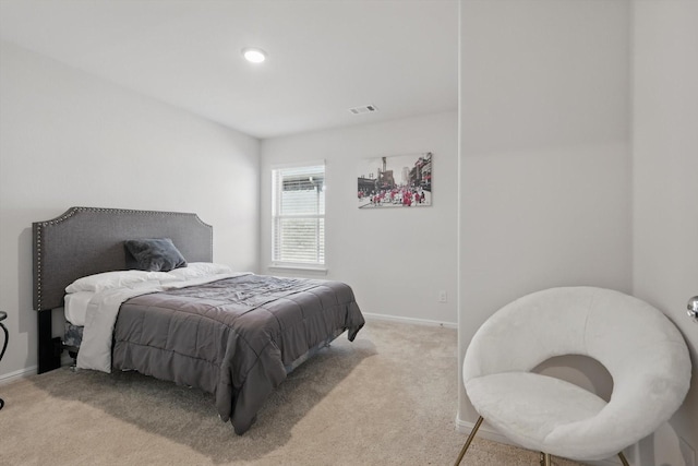 bedroom featuring visible vents, baseboards, and carpet flooring