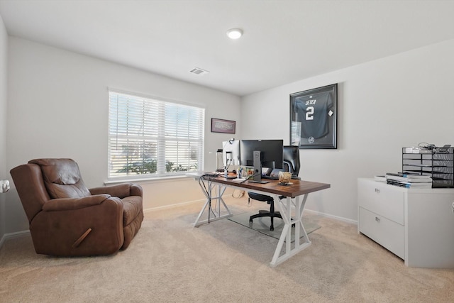 home office featuring light carpet, visible vents, and baseboards