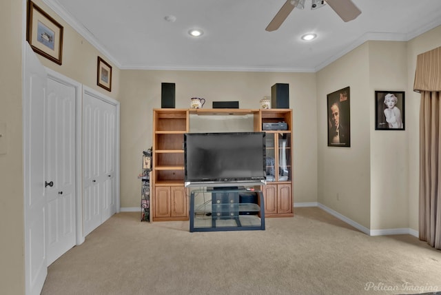 living room with light carpet, baseboards, and ornamental molding