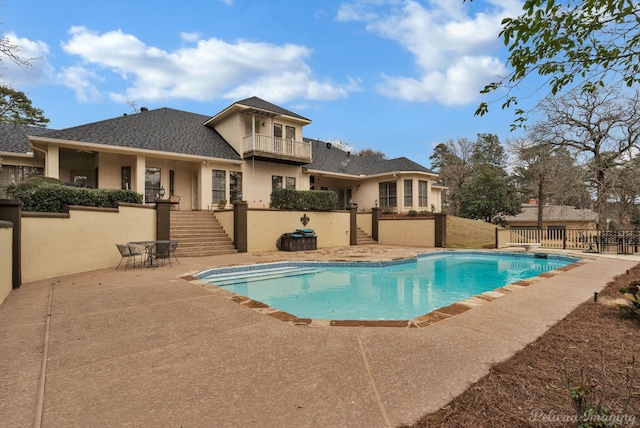 view of pool featuring a patio, stairway, fence, and a fenced in pool