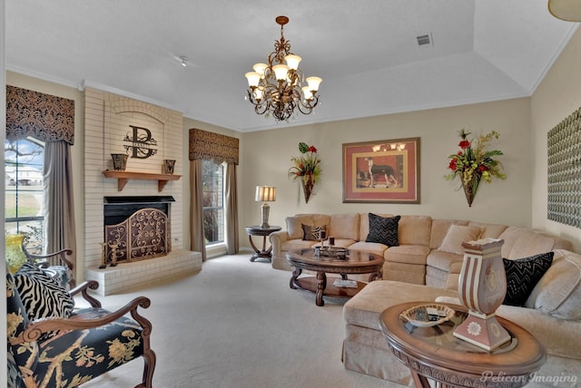 carpeted living area featuring visible vents, a notable chandelier, a brick fireplace, and crown molding