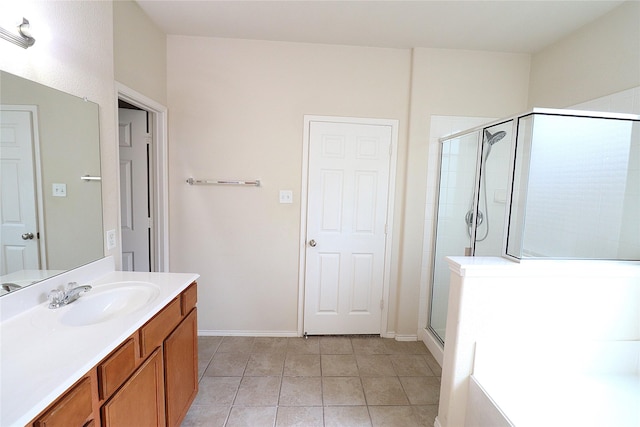 full bathroom featuring tile patterned flooring, a shower stall, vanity, and baseboards