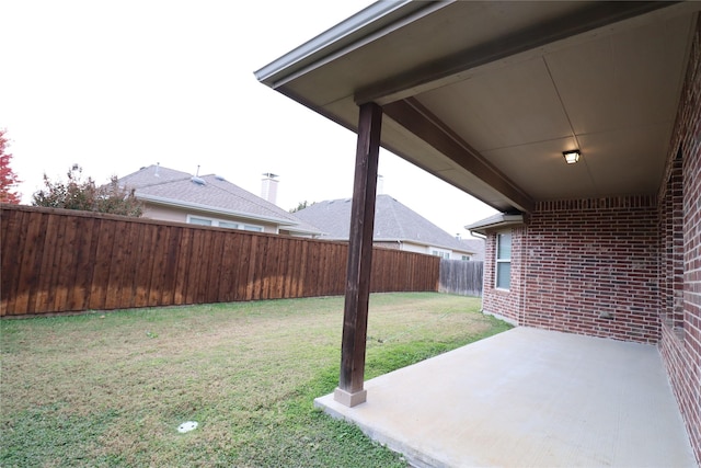 view of yard featuring a fenced backyard and a patio area