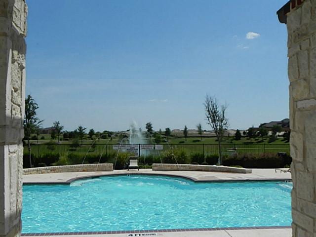 community pool with fence