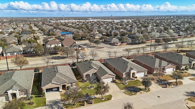 birds eye view of property with a residential view