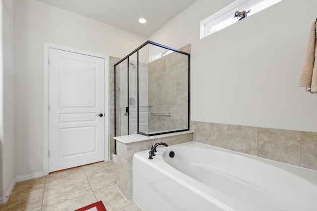 full bathroom featuring recessed lighting, a bath, a shower stall, and tile patterned flooring