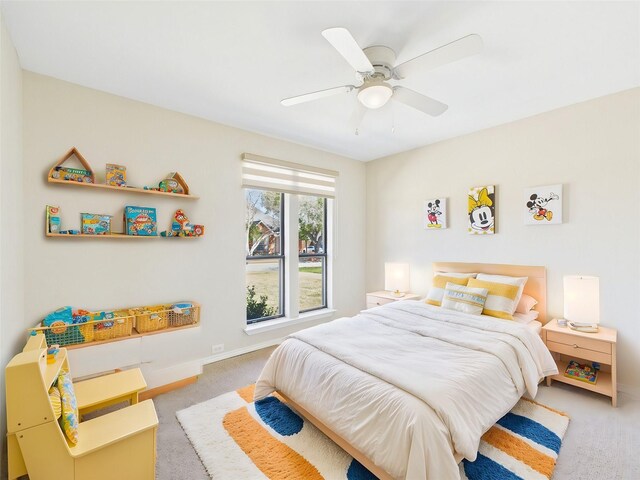 unfurnished bedroom with visible vents, light colored carpet, baseboards, and ceiling fan