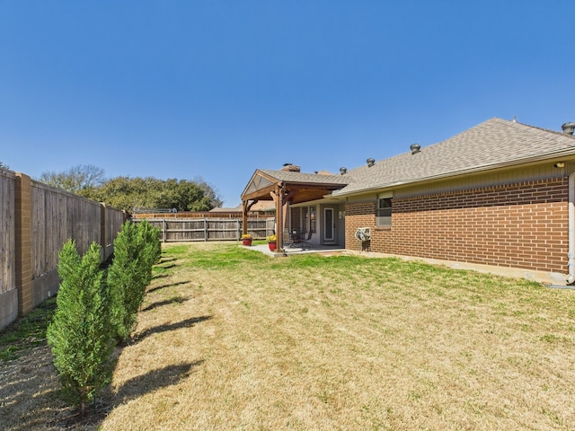 view of yard featuring a patio and a fenced backyard