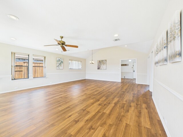 living area with baseboards, wood finished floors, and a fireplace