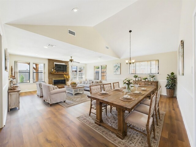 unfurnished living room featuring visible vents, vaulted ceiling, recessed lighting, wood finished floors, and a ceiling fan