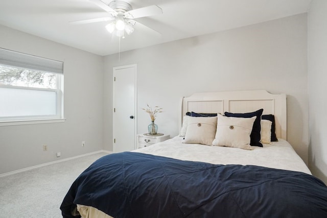 bedroom featuring carpet flooring, a ceiling fan, and baseboards