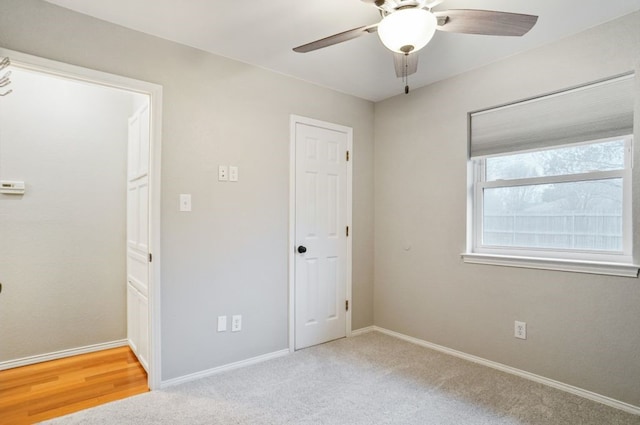 unfurnished bedroom with baseboards, ceiling fan, and carpet flooring