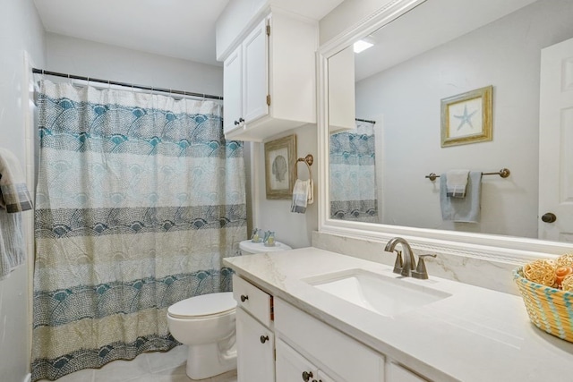 bathroom with tile patterned flooring, curtained shower, toilet, and vanity