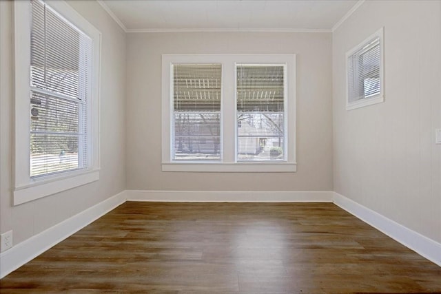 unfurnished room with baseboards, dark wood-style floors, and ornamental molding