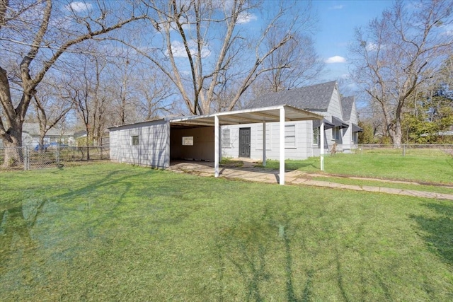 view of yard with a carport and fence