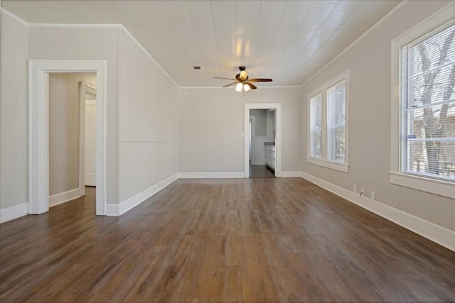 interior space with visible vents, dark wood-style flooring, and ornamental molding