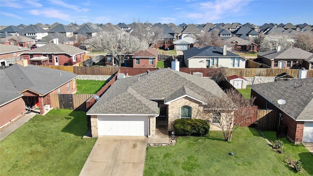 birds eye view of property with a residential view