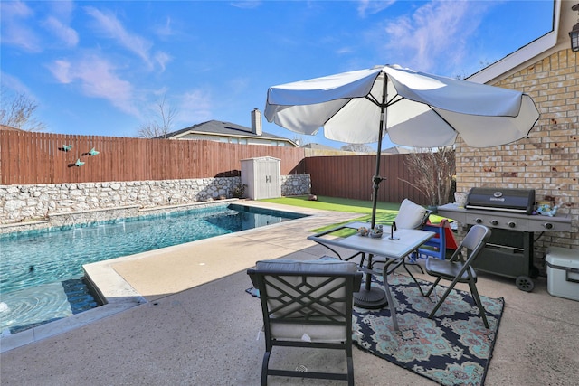 view of swimming pool with a fenced backyard, grilling area, a fenced in pool, and a patio