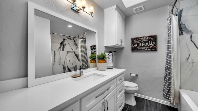 bathroom featuring visible vents, toilet, baseboards, vanity, and a textured wall