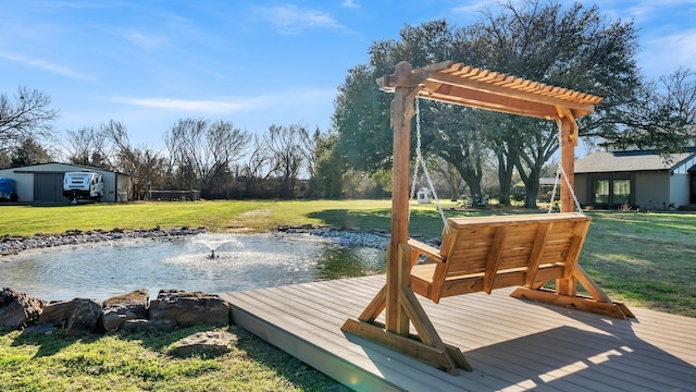 view of dock with a lawn and a pergola