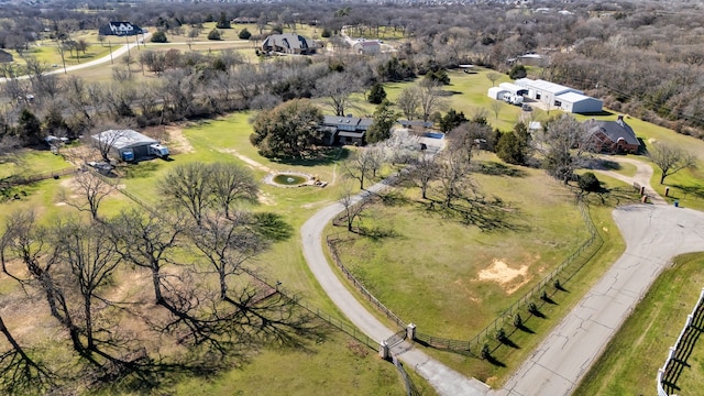 birds eye view of property with a rural view