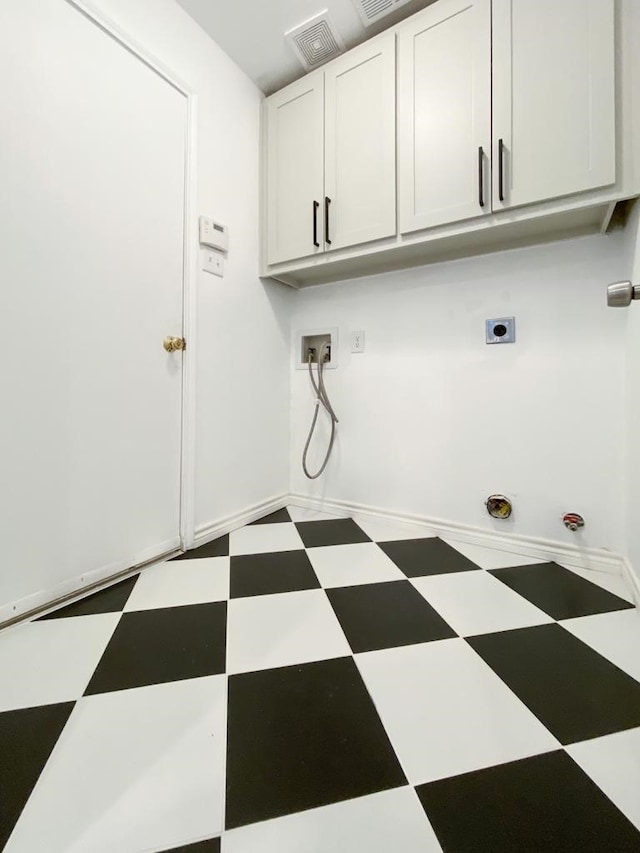 laundry area with visible vents, washer hookup, tile patterned floors, cabinet space, and hookup for an electric dryer