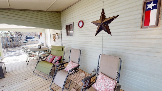 wooden deck featuring a ceiling fan