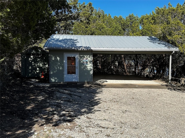 exterior space with an attached carport and driveway