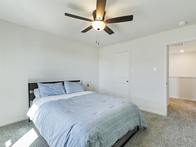 bedroom with a ceiling fan, carpet flooring, baseboards, and visible vents