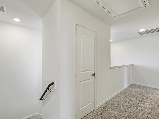 hallway with baseboards, visible vents, recessed lighting, carpet flooring, and an upstairs landing