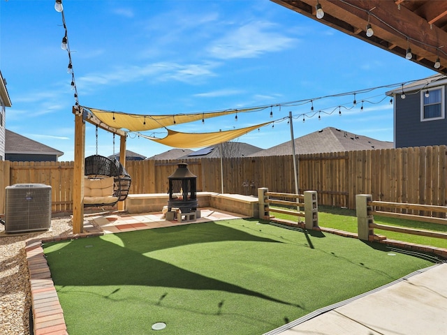 view of yard featuring a patio, cooling unit, and a fenced backyard