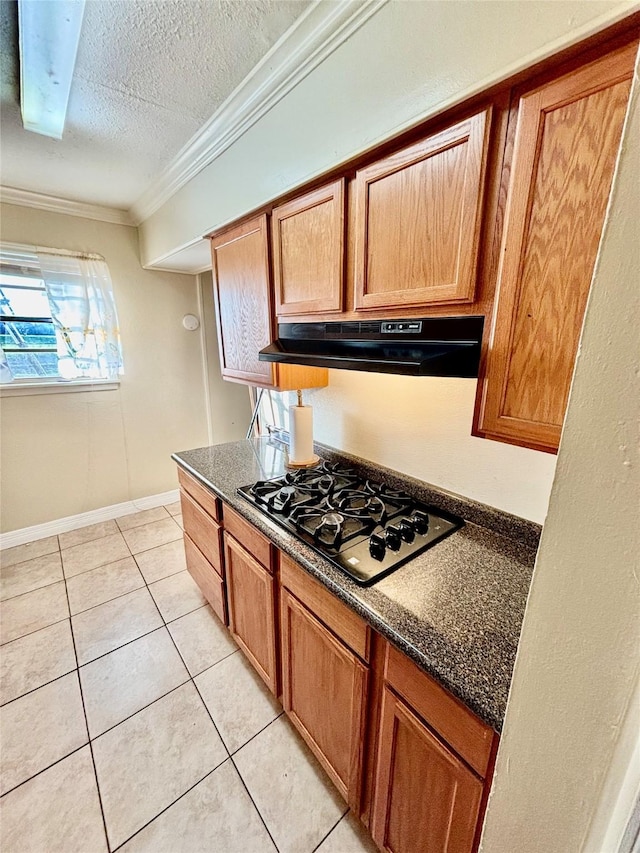 kitchen with crown molding, extractor fan, black gas cooktop, light tile patterned floors, and a textured ceiling