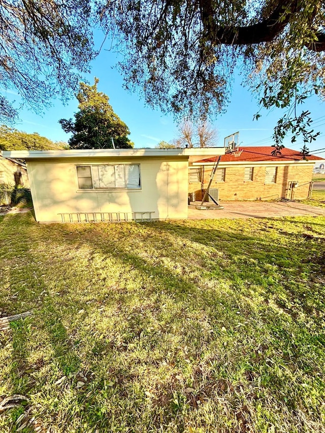 rear view of house with a yard