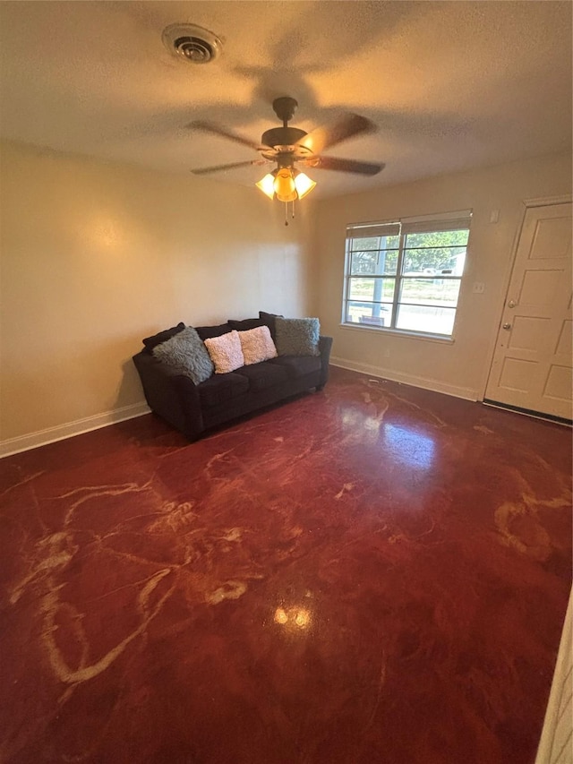 unfurnished living room with visible vents, baseboards, a textured ceiling, and concrete flooring