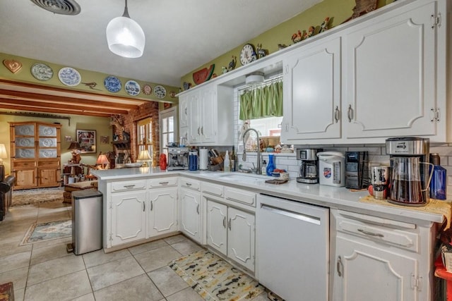 kitchen featuring a sink, visible vents, dishwasher, and white cabinetry