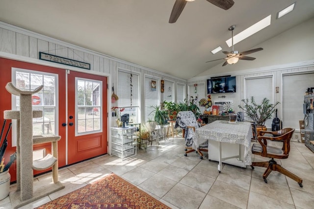 sunroom / solarium with french doors, lofted ceiling, and a ceiling fan