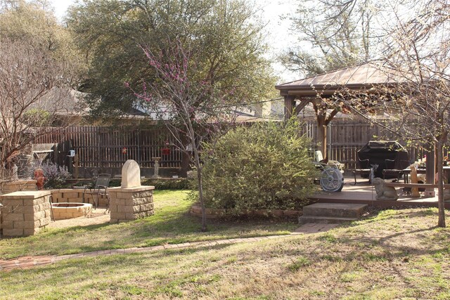 view of yard with a gazebo and fence