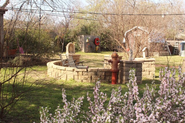 view of yard featuring entry steps, french doors, and an outdoor structure