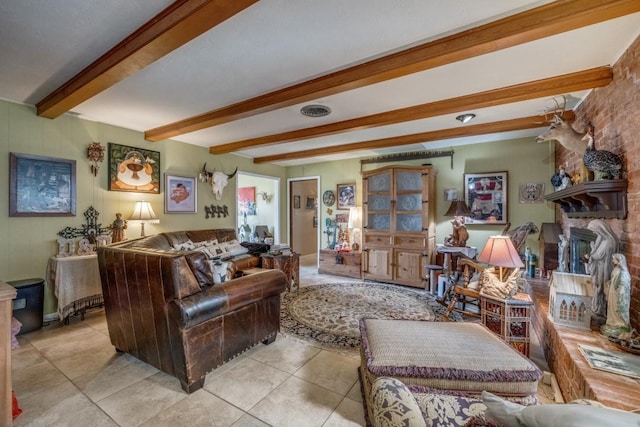 living room with beam ceiling, light tile patterned floors, a fireplace, and visible vents