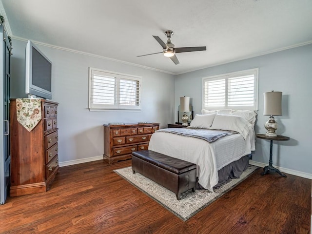 bedroom with crown molding, dark wood-type flooring, and baseboards