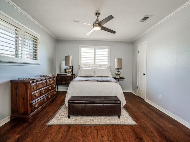 bedroom featuring visible vents, baseboards, ornamental molding, wood finished floors, and a ceiling fan