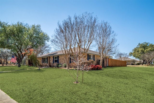 single story home featuring a front lawn and brick siding