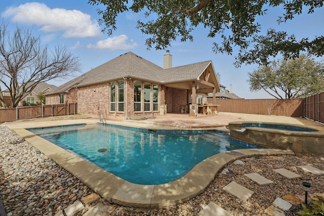 view of swimming pool with an in ground hot tub, a fenced backyard, a fenced in pool, and a patio